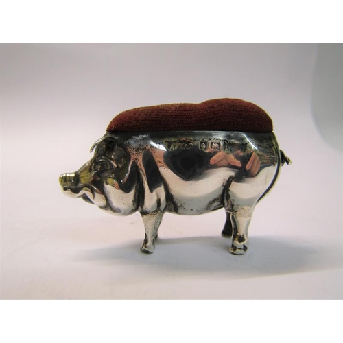 169 - An Edwardian silver pig pin cushion, makers mark for Able & Lovekin, Birmingham 1905, 5.5cm w.