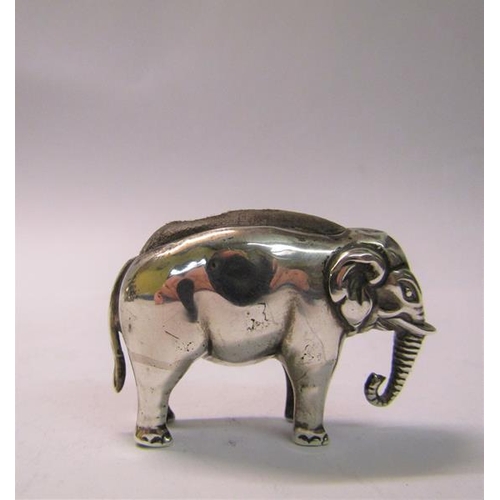 173 - An Edwardian silver elephant pin cushion, makers mark for Skinner & Co, Birmingham 1909, 5cm w.