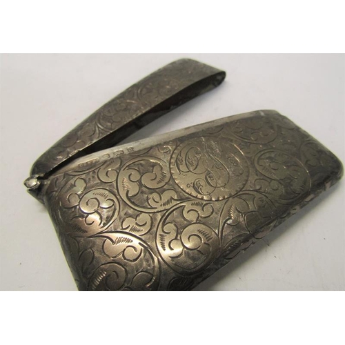 180 - A late Victorian visiting card case of curved form with hinged cover, chased with leaf and scrollwor... 