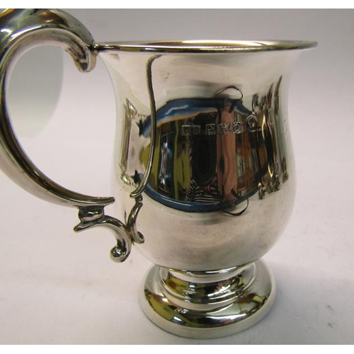 184 - A christening tankard of baluster form with a double scroll handle, makers mark for William Adams, B... 