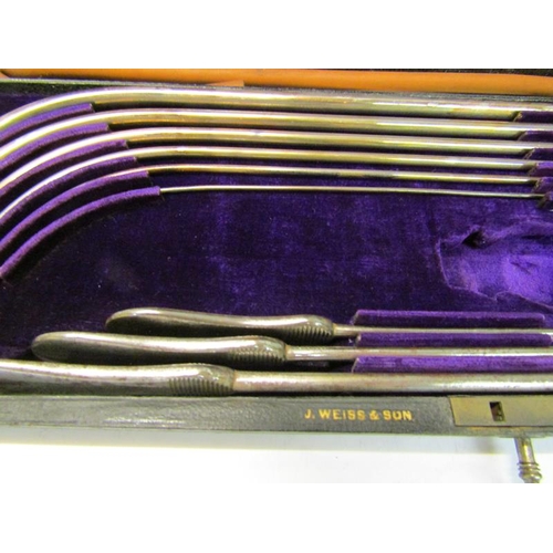 229 - A boxes set of silver catheters by J Weiss & Son, Strand, London, presented in 1876.  Not assayed bu... 