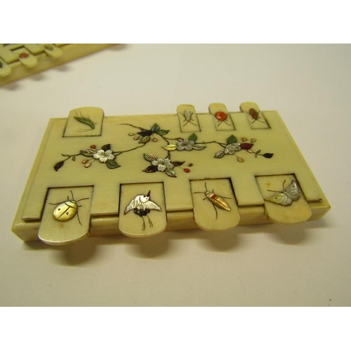 71 - A pair of Meiji period ivory whist markers, the keys mounted with mother of pearl and painted insect... 