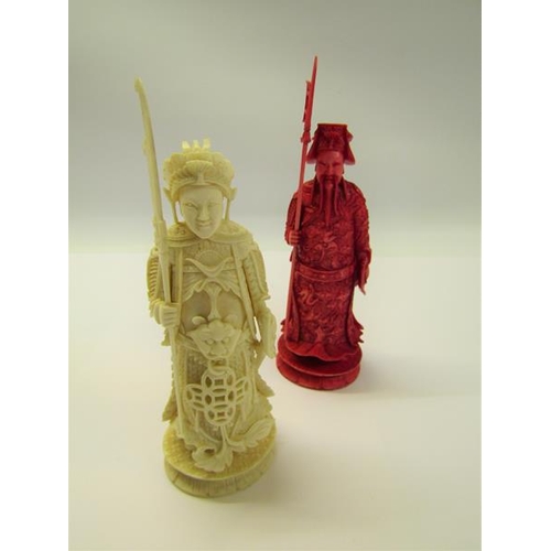 73 - Two 19c Chinese carved ivory chess pieces, both in the form of warriors, one white and one red stain... 