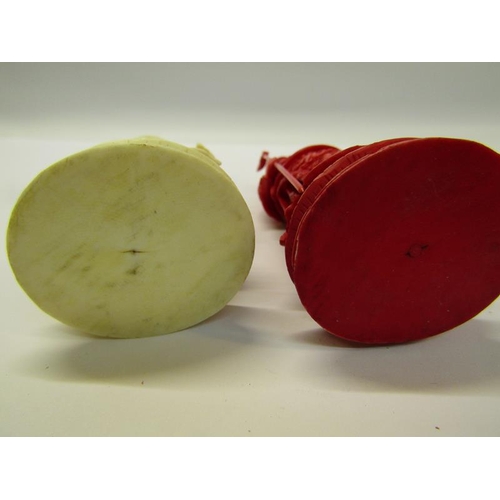 73 - Two 19c Chinese carved ivory chess pieces, both in the form of warriors, one white and one red stain... 