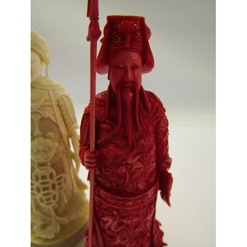 73 - Two 19c Chinese carved ivory chess pieces, both in the form of warriors, one white and one red stain... 