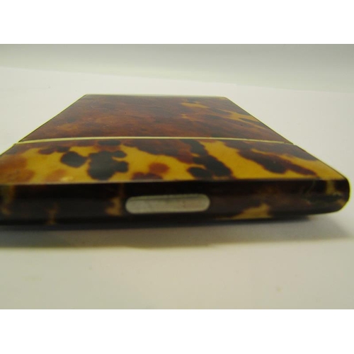 77 - A late 19c tortoiseshell visiting card case with ivory rims, 8cm x 10.5cm.