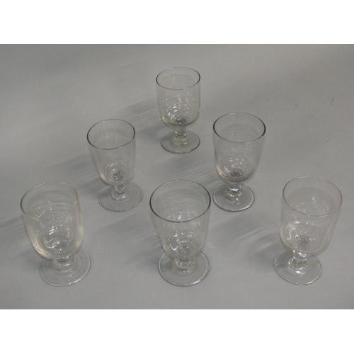 251 - A matched set of six wine glasses with bucket shaped bowls on short lobed stems with circular bases,... 