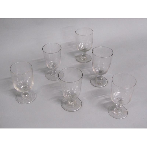 251 - A matched set of six wine glasses with bucket shaped bowls on short lobed stems with circular bases,... 