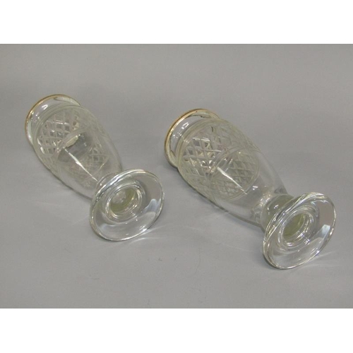 253 - A pair of 19c cut glass vases of baluster form with silver upper rims and supported on circular base... 