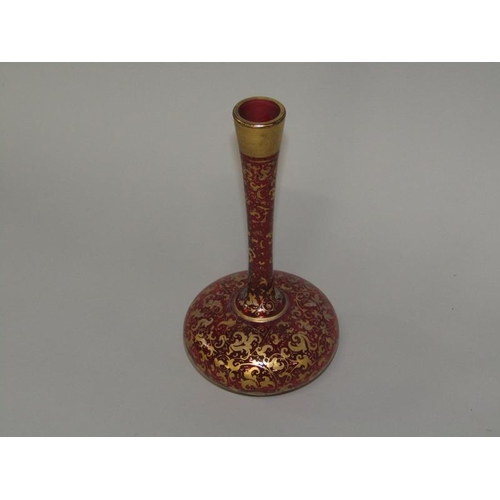 259 - A Victorian ruby glass specimen vase with a squat baluster body, tall slender neck, gilt decorated, ... 