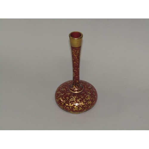 259 - A Victorian ruby glass specimen vase with a squat baluster body, tall slender neck, gilt decorated, ... 