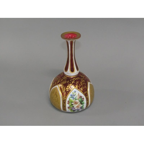 260 - A 19c Bohemian ruby glass vase of baluster form gilt decorated and with lappet shaped floral painted... 