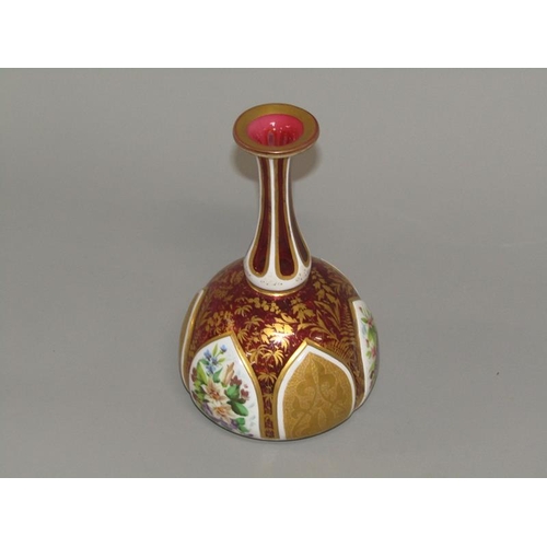 260 - A 19c Bohemian ruby glass vase of baluster form gilt decorated and with lappet shaped floral painted... 