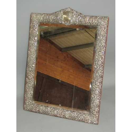 240 - A late Victorian silver easel dressing table mirror within a pierced scroll and floral border with a... 