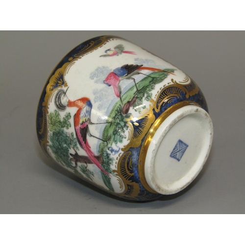 274 - A First period Worcester cup and saucer of scale blue ground painted with exotic birds within ornate... 