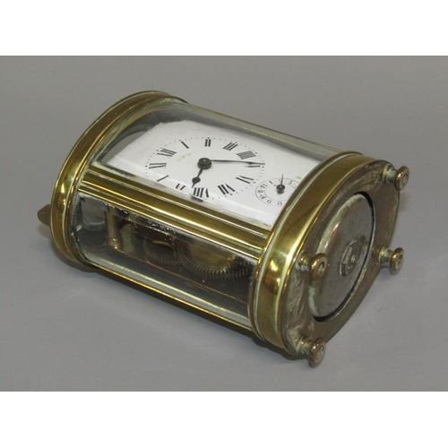 6 - A late 19c French carriage clock in glazed brass oval case.  The single train movement has a cylinde... 