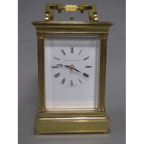 7 - A late 20c Swiss carriage clock by Matthew Norman in glazed brass Corinthian case with fluted column... 