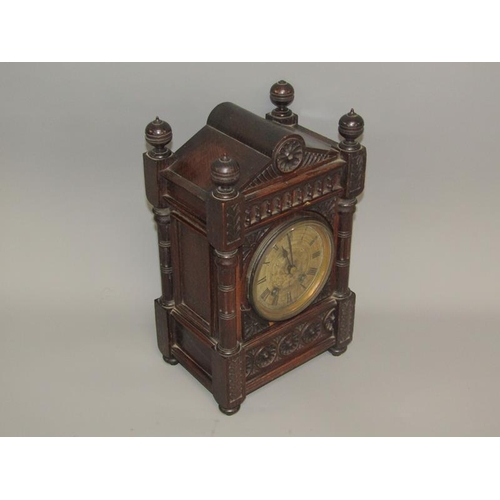 9 - A late 19c German mantel clock by Lenzkirch in carved oak case of rectangular form with circular col... 