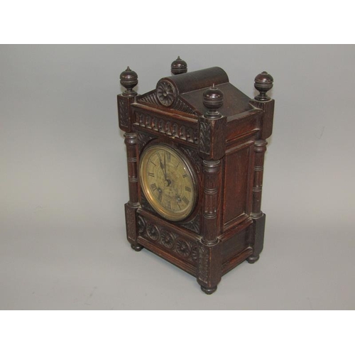 9 - A late 19c German mantel clock by Lenzkirch in carved oak case of rectangular form with circular col... 