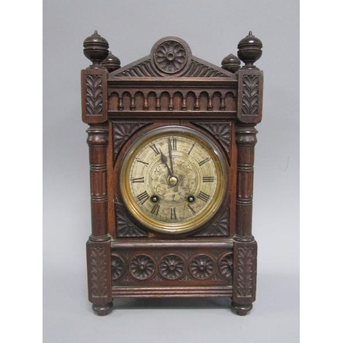 9 - A late 19c German mantel clock by Lenzkirch in carved oak case of rectangular form with circular col... 