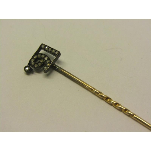 149 - An early 20c gold stick pin with a diamond set terminal - 16, 6cm l.