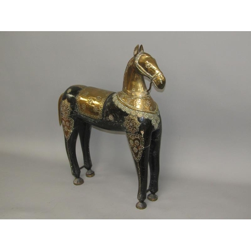 43 - A 19c Oriental model of a horse, black lacquered carved wood with brass head and harness, 70cm h, 64... 