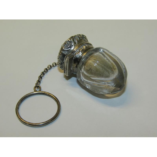 80 - A Victorian cut glass vinaigrette with embossed and chased silver grill and mount, together with a h... 