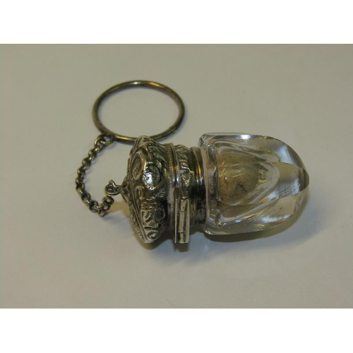 80 - A Victorian cut glass vinaigrette with embossed and chased silver grill and mount, together with a h... 