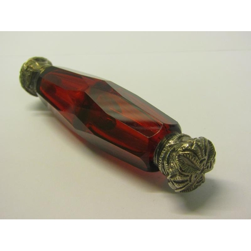 82 - A collection of three late 19c/early 20c cut ruby glass double ended scent bottles with silver embos... 