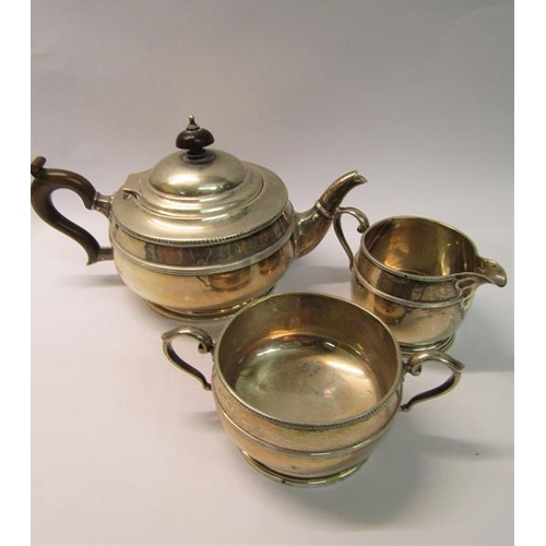 221 - A three piece silver teaset, makers mark for Mappin & Webb, Birmingham 1919, teapot 24cm w, total 27... 