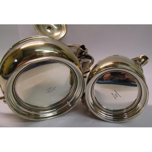 221 - A three piece silver teaset, makers mark for Mappin & Webb, Birmingham 1919, teapot 24cm w, total 27... 