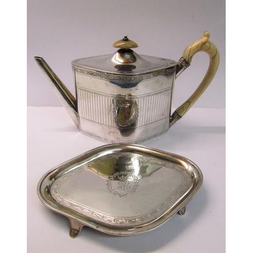 236 - A George III silver teapot, chased and decorated in a Regency style with a straight spout and bone h... 