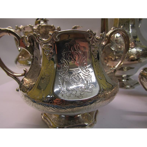 239 - A mid Victorian silver four piece tea and coffee service of chased facet baluster form, the coffee a... 