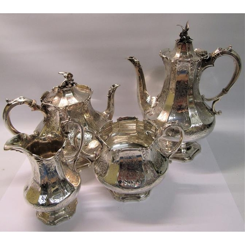 239 - A mid Victorian silver four piece tea and coffee service of chased facet baluster form, the coffee a... 