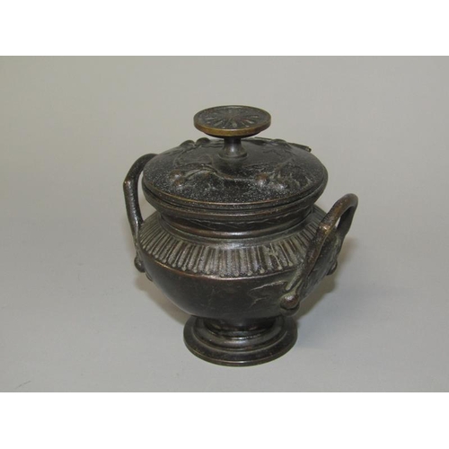 17 - A late 19c Continental patinated bronze two handled bowl of urn form with hinged cover, 9.5cm h.