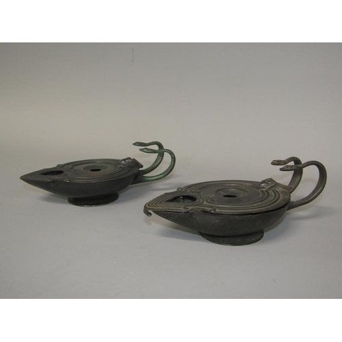 26 - A pair of early 20c B & AB patent bronzed Genie style oil lamps with snake handles, 17.5cm w.