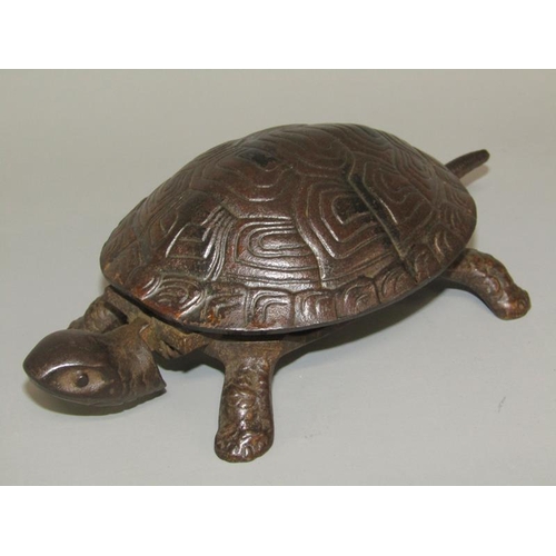 28 - An early 20c bronze patinated novelty table bell in the form of a turtle, base marked GSS, the bell ... 