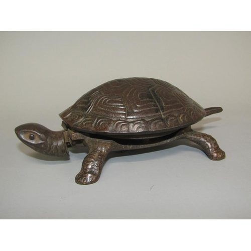 28 - An early 20c bronze patinated novelty table bell in the form of a turtle, base marked GSS, the bell ... 