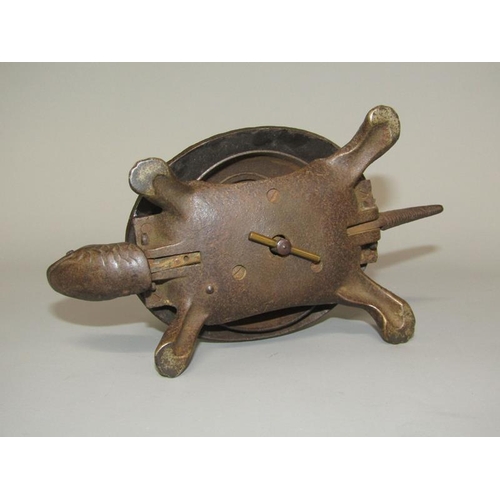 28 - An early 20c bronze patinated novelty table bell in the form of a turtle, base marked GSS, the bell ... 