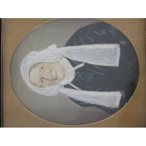 88 - A Victorian oval portrait miniature on ivory of a lady in black costume wearing a white bonnet with ... 