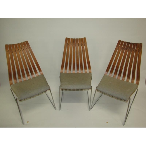 454 - A set of six Norwegian dining chairs of slatted design with metal legs and under frames, designed by... 