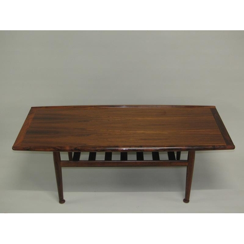 455 - A 1970's France & Son low table of shaped rectangular form, having moulded and raised side edges, cr... 