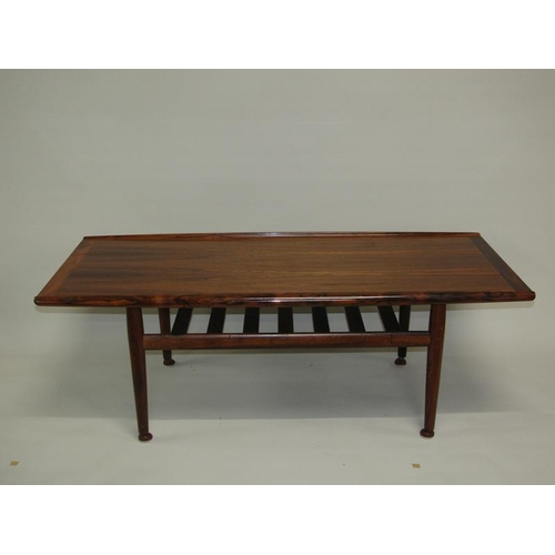 455 - A 1970's France & Son low table of shaped rectangular form, having moulded and raised side edges, cr... 