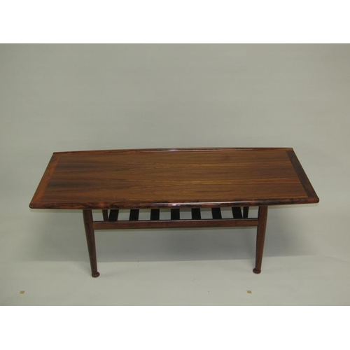 455 - A 1970's France & Son low table of shaped rectangular form, having moulded and raised side edges, cr... 