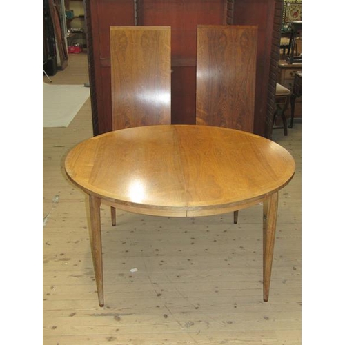 450 - A 1960/70's Rosegaarden veneered and crossbanded extending dining table with rounded end, supported ... 