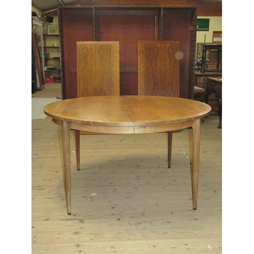 450 - A 1960/70's Rosegaarden veneered and crossbanded extending dining table with rounded end, supported ... 