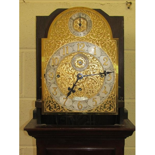 10 - An Edwardian longcase clock retailed by Sir John Bennett Ltd and having a substantial three train mo... 