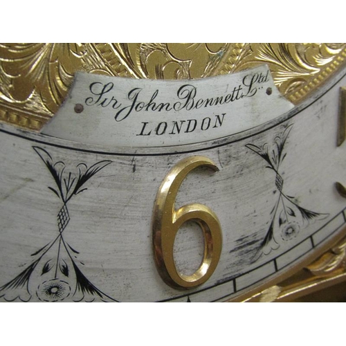 10 - An Edwardian longcase clock retailed by Sir John Bennett Ltd and having a substantial three train mo... 