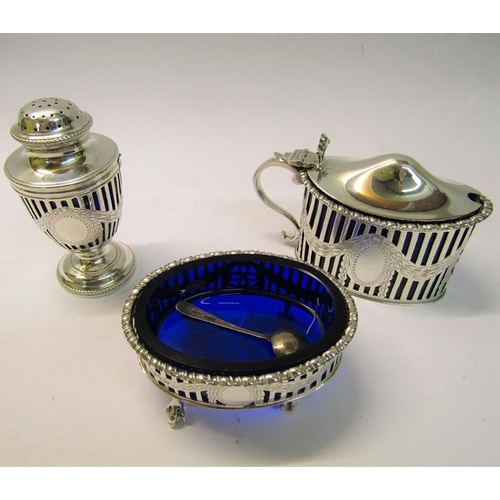 203 - An early 20c silver three piece condiment comprising a pierced silver mustard, salt and a pepper, tw... 