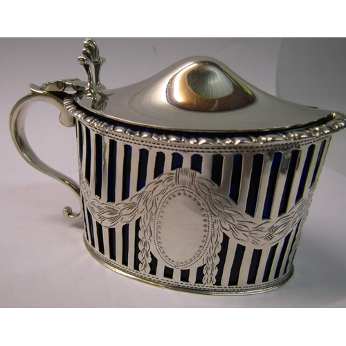 203 - An early 20c silver three piece condiment comprising a pierced silver mustard, salt and a pepper, tw... 